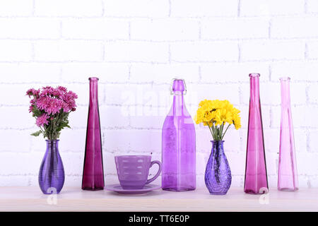 Fireplace with beautiful purple decorations in room Stock Photo