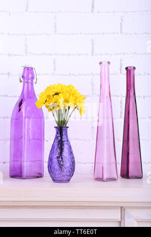 Fireplace with beautiful purple decorations in room Stock Photo