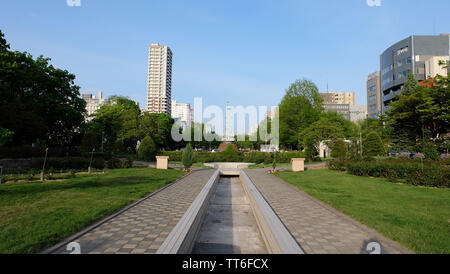 SAPPORO, JAPAN - May 18, 2019: Odori Park in the late afternoon on a nice sunny day with blue sky. Stock Photo