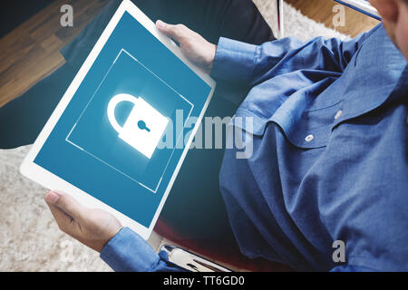 Mobile device security system. a man using digital tablet and lock icon on screen Stock Photo