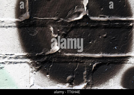 Brick wall painted in different colors close up. Abstract background Stock Photo