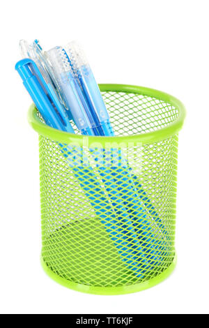 Blue pens in green metal vase isolated on white background Stock Photo