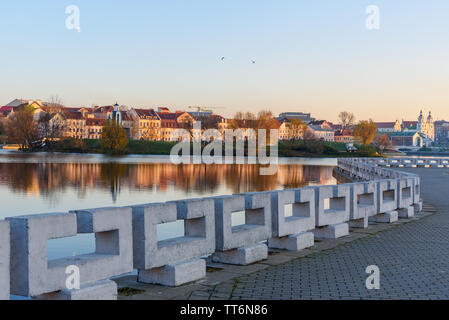 View of Upper Town and Traetskae Pradmestse or Trinity Suburb and Island of Tears Chapel or Island of Courage and Sorrow on Svisloch river bank in his Stock Photo