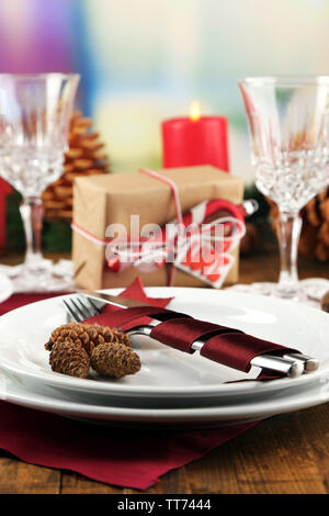 Holiday table setting with Christmas decoration background Stock Photo