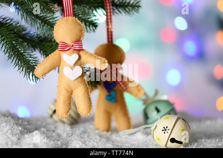 Christmas handmade decorations hanging on Christmas tree on blurred background Stock Photo