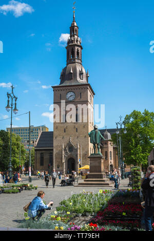 Oslo Cathedral, view of the tower of the Oslo Domkirke (cathedral) with the Stortorvet flower market in the foreground, Norway. Stock Photo