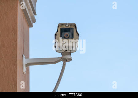 outdoor security cameras or outdoor surveillance cameras on a wall, video protection safety system guard Stock Photo