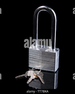 Padlock with keys isolated on black Stock Photo