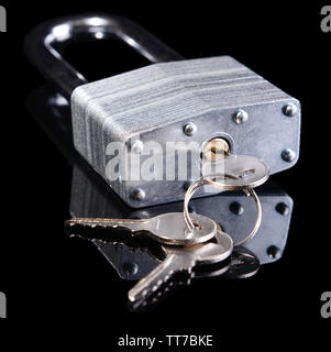 Padlock with keys isolated on black Stock Photo