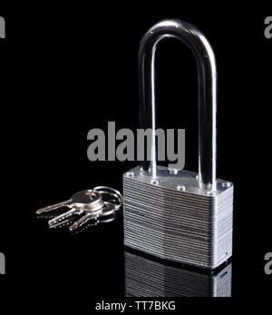 Padlock with keys isolated on black Stock Photo