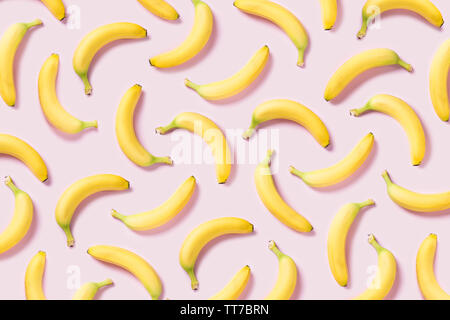 Yellow bananas pattern on pink background Stock Photo