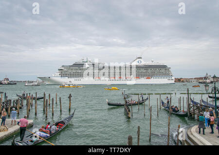 Italy, Veneto, Venice - MSC Riviera cruise ship leaving Venice at Bacino San Marco, blocking the beautiful view of San Giorgio Maggiore (26 may 2019) Stock Photo