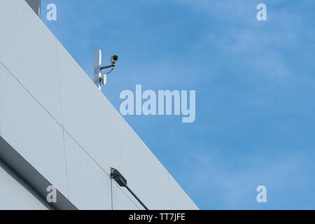 Security CCTV camera or surveillance system in office building Stock Photo