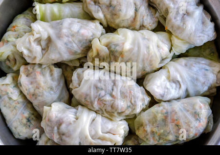 Close-up shot of Cabbage Rolls or Dolma. Stuffed cabbage leaves with minced meat, rice, vegetables and herbs. Sarma, golubtsy, dolmades or golabki Stock Photo