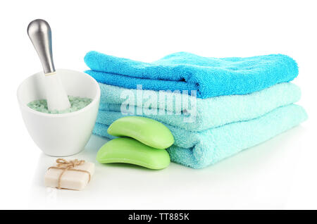 Towels with soap and sea salt isolated on white Stock Photo