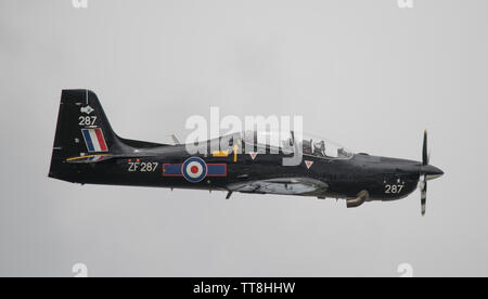 Dunsfold Park, Cranleigh, Surrey, UK. 15th June 2019. 15th and final Dunsfold Wings and Wheels features dynamic air and motoring displays, running from 15th-16th June. The historic WW2 airfield closes shortly to be demolished for new housing. Image: RAF Tucano T.Mk 1 trainer display. Credit: Malcolm Park/Alamy Live News. Stock Photo