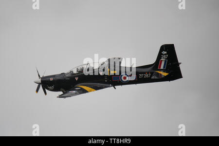 Dunsfold Park, Cranleigh, Surrey, UK. 15th June 2019. 15th and final Dunsfold Wings and Wheels features dynamic air and motoring displays, running from 15th-16th June. The historic WW2 airfield closes shortly to be demolished for new housing. Image: RAF Tucano T.Mk 1 trainer display. Credit: Malcolm Park/Alamy Live News. Stock Photo