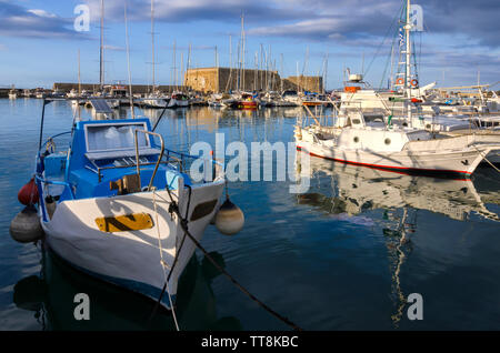 Heraklion, Crete Island - Greece. Fortress Koules (Castello a Mare) at the old Venetian port in Heraklion city. Warm sun light creates reflections Stock Photo