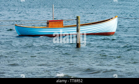 Fishing boat tethered to post in baltic sea horizontal panorama Stock Photo