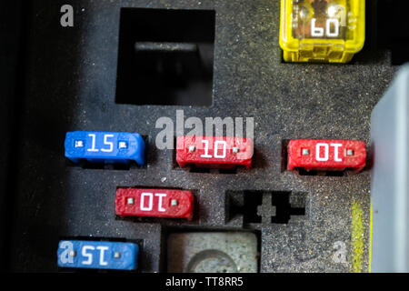 blade style automotive fuses in a fuse distribution box Stock Photo