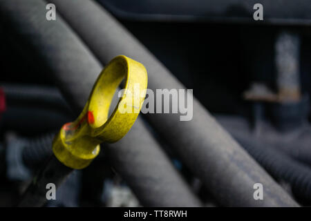 a close up of an standard engine oil measuring dipstick as found on a vehicle Stock Photo