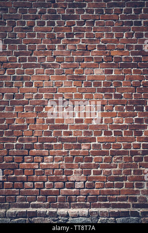Color toned picture of a dark brick wall. Stock Photo