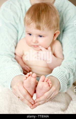 Newborn baby in mother hugs, close-up Stock Photo