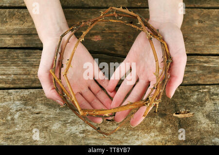 Crown of thorns in hands, close up Stock Photo