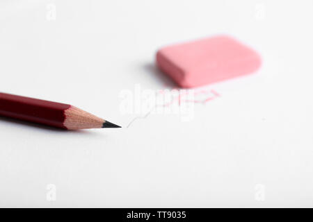 Eraser and pencil on paper background Stock Photo