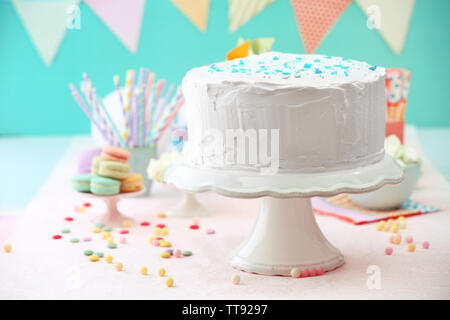 Birthday decorated cake on color background Stock Photo