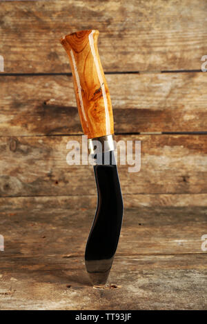 Hunting knife on wooden background Stock Photo