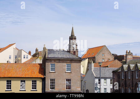 The town hall clock standing proudly above the houses in Berwick upon Tweed. Berwick-upon-Tweed sits at the most northerly tip of Northumberland. Stock Photo