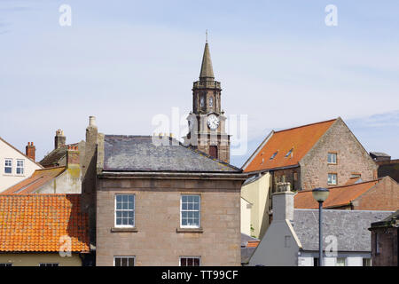 The town hall clock standing proudly above the houses in Berwick upon Tweed. Berwick-upon-Tweed sits at the most northerly tip of Northumberland. Stock Photo