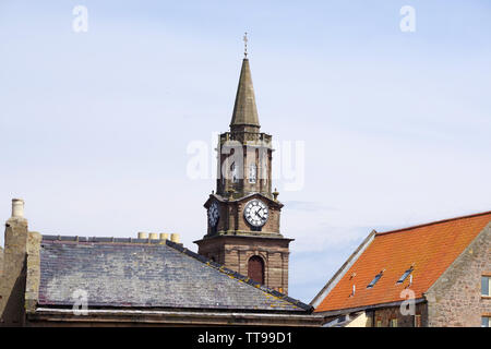 The town hall clock standing proudly above the houses in Berwick upon Tweed. Berwick-upon-Tweed sits at the most northerly tip of Northumberland. Stock Photo