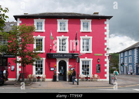 The Castle Hotel, exterior of the brightly painted red building, in Aberaeron, Ceredigion, Wales Stock Photo