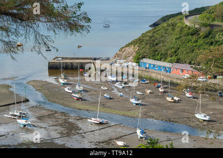 The picturesque Lower Town, the old port of Fishguard, with pretty harbour and cottages at the mouth of the Gwaum River, Pembrokeshire, Wales, UK Stock Photo