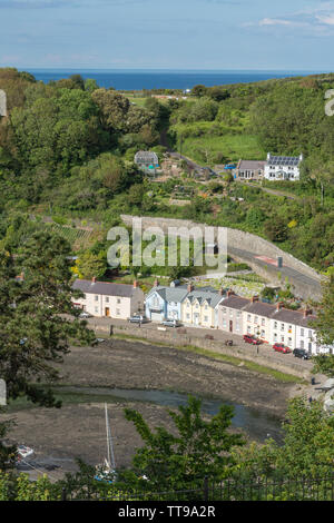 The picturesque Lower Town, the old port of Fishguard, with pretty harbour and cottages at the mouth of the Gwaum River, Pembrokeshire, Wales, UK Stock Photo