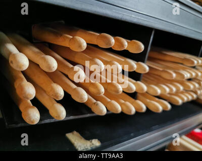 drum sticks tips front view on the shelf of a music store Stock Photo