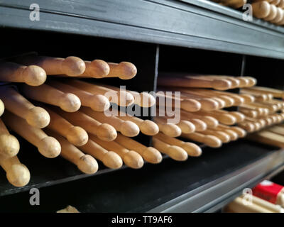 drum sticks tips front view on the shelf of a music store Stock Photo