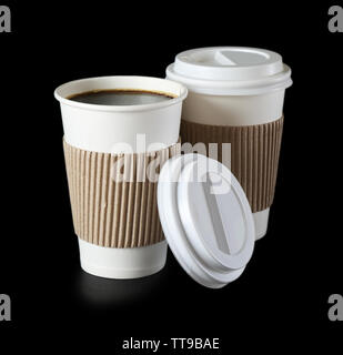 Paper cups of coffee on black background Stock Photo