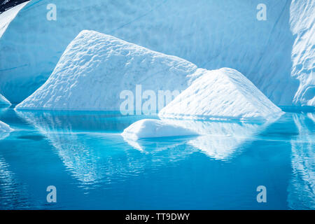 Large blue pool of melting ice as the weather warms up on the Matanuska Glacier in Alaska. Stock Photo