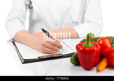 Nutritionist doctor writing  diet plan, isolated on white Stock Photo