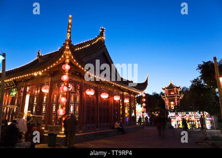 The Friendship Hall pavilion and the Magic of Lanterns exhibit at dusk in the Chinese Garden, Montreal Botanical Garden, Quebec, Canada Stock Photo