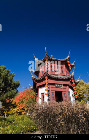 The Tower of Condensing Clouds pavilion and The Magic of Lanterns exhibit in the Chinese Garden in autumn, Montreal Botanical Garden, Quebec, Canada Stock Photo