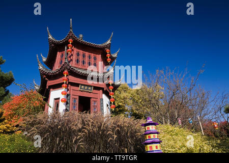 The Tower of Condensing Clouds pavilion and The Magic of Lanterns exhibit in the Chinese Garden in autumn, Montreal Botanical Garden, Quebec, Canada Stock Photo