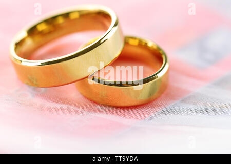 Golden wedding rings and credit card isolated on white. Marriage of convenience concept Stock Photo Alamy