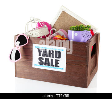 Box of unwanted stuff ready for yard sale isolated on white Stock Photo