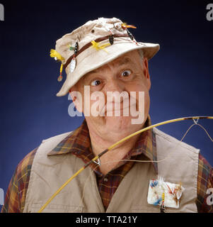 An old fisherman with a white hat is fishing with his fishing pole on the  pier of the harbor (Pesaro, Italy, Europe Stock Photo - Alamy
