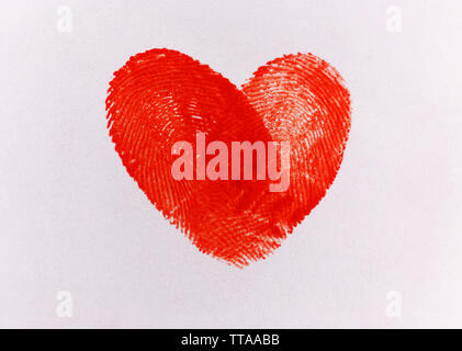 Heart of fingerprints on white paper background Stock Photo