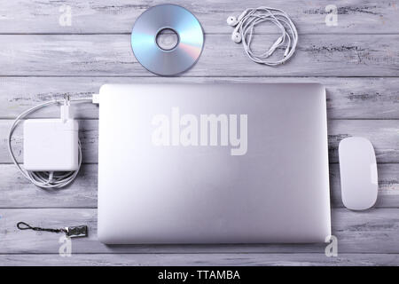 Workplace with laptop and other computer accessories on wooden background Stock Photo